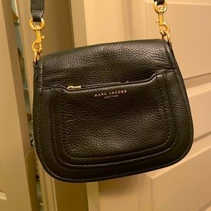 Marc Jacob’s black cross body purse, slightly used. Outside zipper and flap.